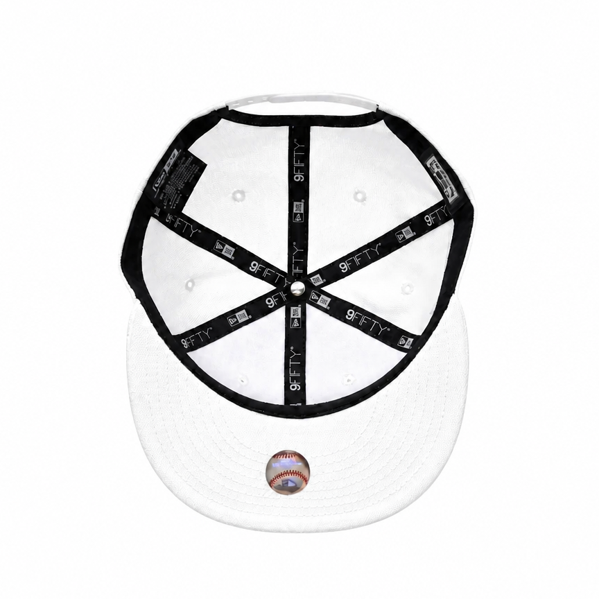 White baseball cap with black adjustable strap system and a baseball patch on the front of the visor, shown from the back against a white background.