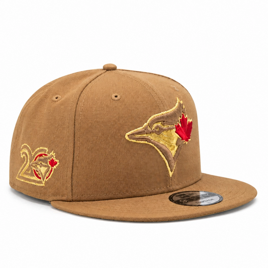 NEW ERA 9FIFTY MLB TORONTO BLUE JAYS 20TH ANNIVERSARY LIGHT BRONZE GOLD SNAPBACK HAT