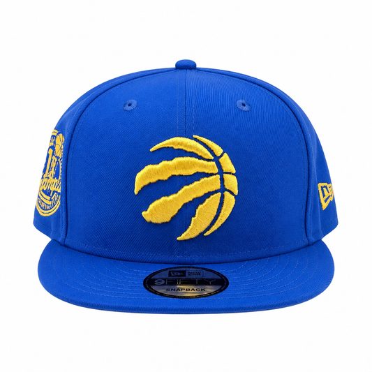 NEW ERA 9FIFTY NBA TORONTO RAPTORS 1X CHAMPS BLACK ROYAL BLUE/GOLD SNAPBACK HAT