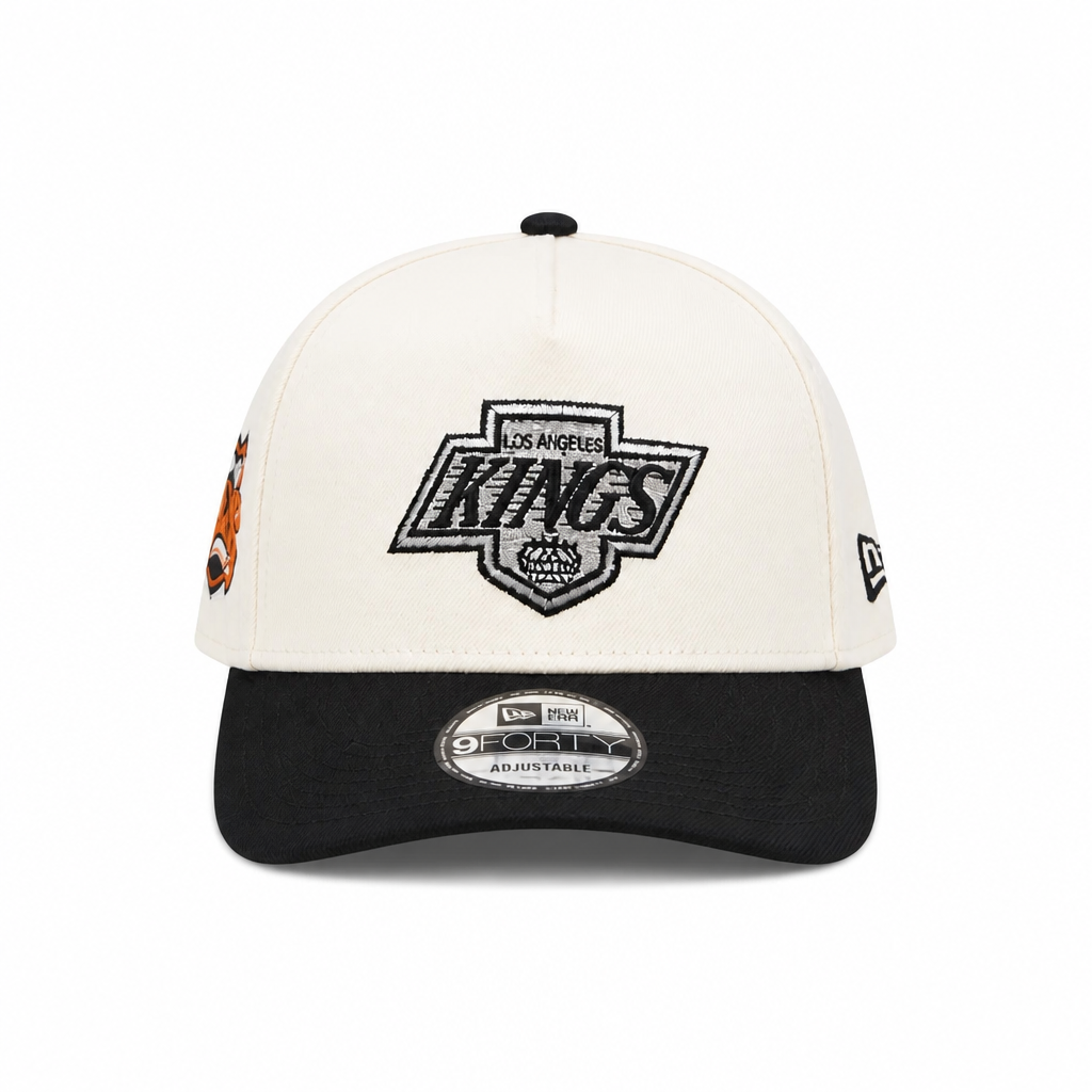NEW ERA MEN'S 9FORTY A-FRAME NHL LOS ANGELES KINGS PRINCE OF WALES CONFERENCE CREAM/BLACK SNAPBACK HAT