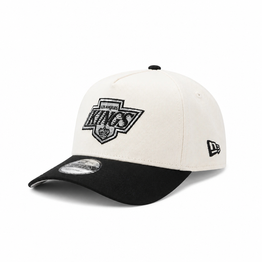 NEW ERA MEN'S 9FORTY A-FRAME NHL LOS ANGELES KINGS PRINCE OF WALES CONFERENCE CREAM/BLACK SNAPBACK HAT