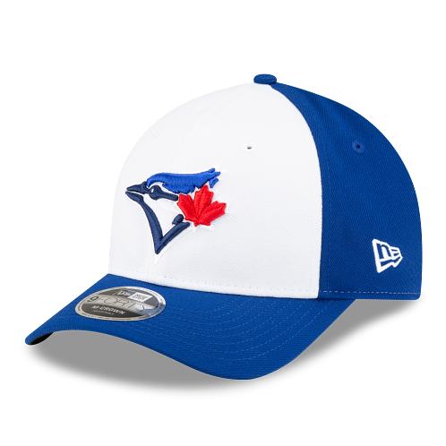 A Toronto Blue Jays baseball cap by New Era, featuring a white front panel and royal blue side panels and brim, with the team's blue jay and red maple leaf logo embroidered on the front.